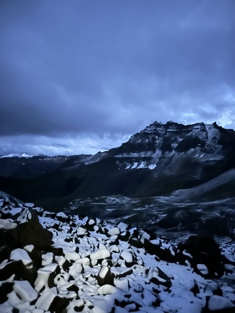 A snowy mountain in the dim light before the sun rose.